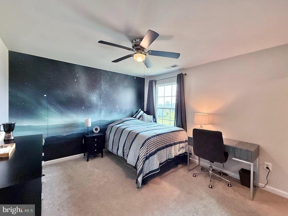 3012 Wasatch View Drive Frederick, MD 21704 - Photo 34 of 54 a spacious bedroom with a bed and a chandelier