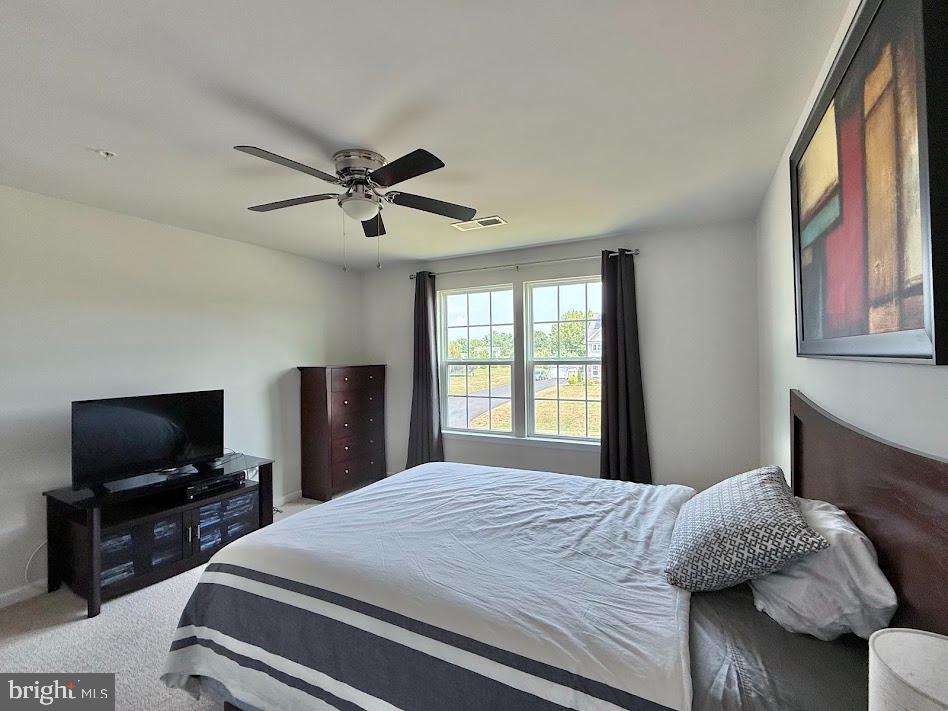 3012 Wasatch View Drive Frederick, MD 21704 - Photo 38 of 54 a bedroom with a bed and a flat screen tv