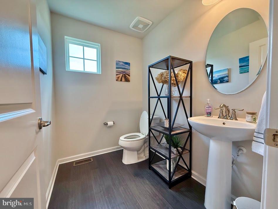 3012 Wasatch View Drive Frederick, MD 21704 - Photo 10 of 54 a bathroom with a toilet sink and mirror