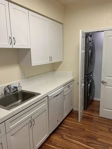 a kitchen with a sink and cabinets
