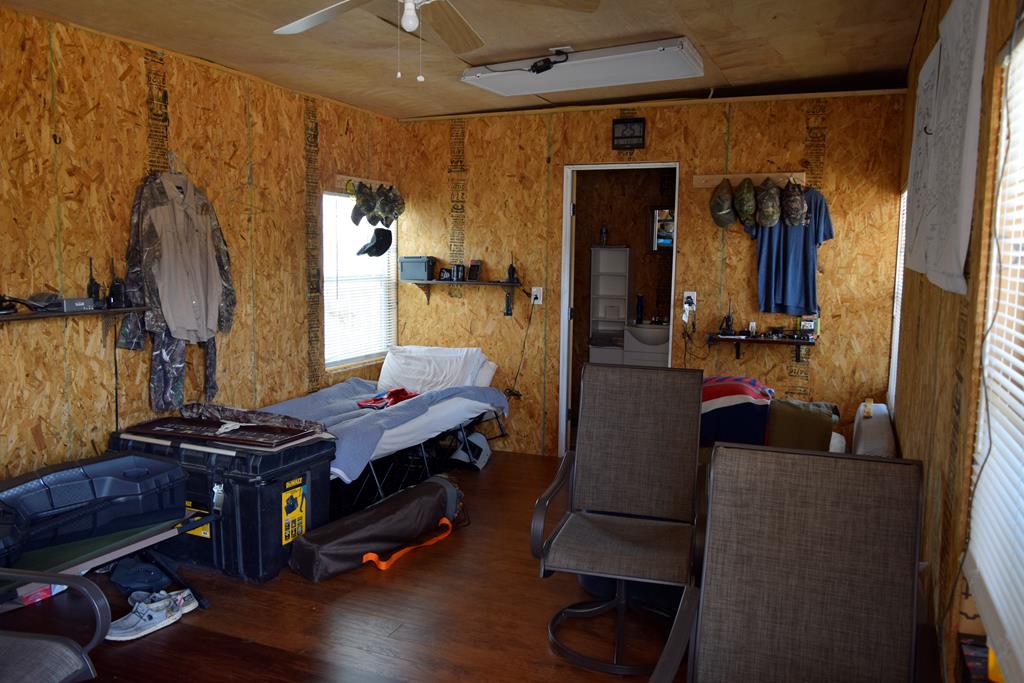 2523 Southwest St Rocksprings Tx 78880 Del Rio, TX 78840 - Photo 17 of 80 a room with furniture and wooden floor