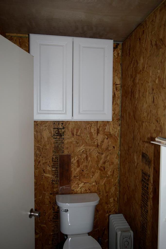 2523 Southwest St Rocksprings Tx 78880 Del Rio, TX 78840 - Photo 20 of 80 a bathroom with a toilet and a shower curtain