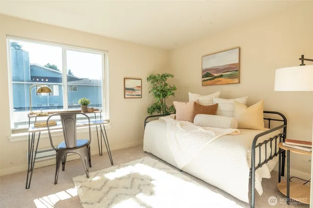 a bedroom with a bed and a chair