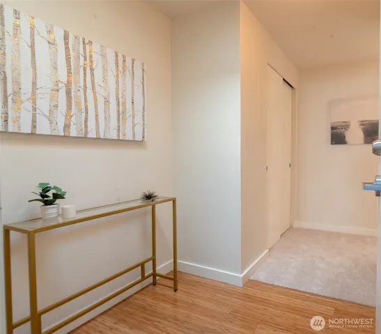 a view of front door with wooden floor