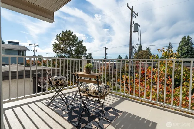 a view of a balcony with chairs