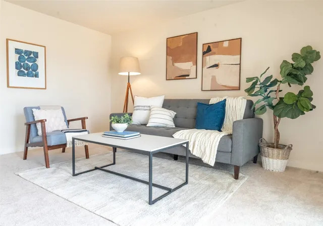 a living room with furniture flowerpot and a potted plant