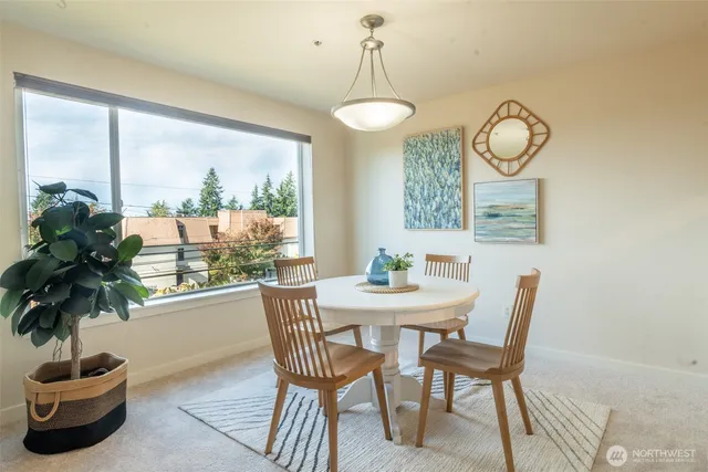 a view of a dining room with furniture window and outside view