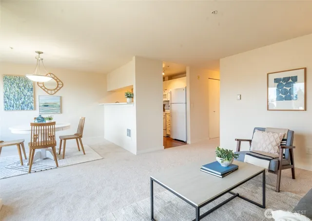 a living room with furniture and a table