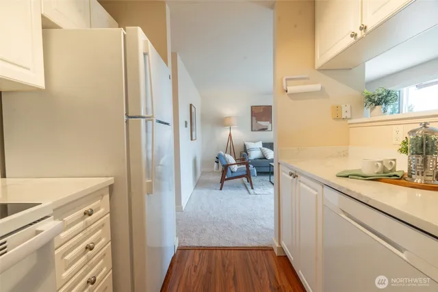 a view of a kitchen from the hallway