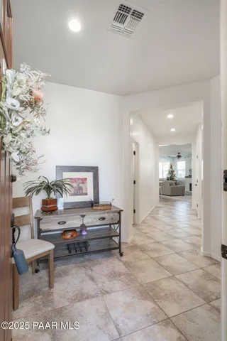 a living room with furniture and a painting