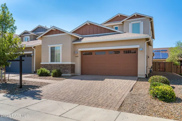 a house with a tree in front of it