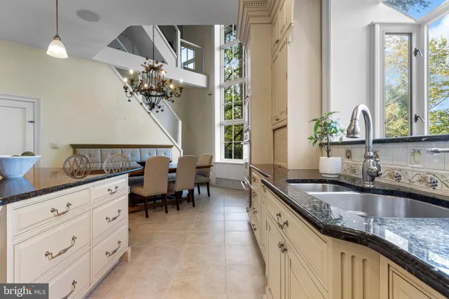 a view of a hallway with wooden floor and windows