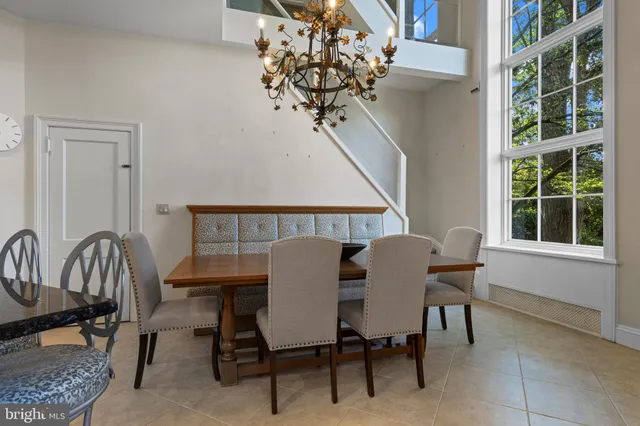a living room with furniture and large windows
