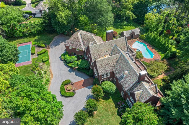 an aerial view of a house with outdoor space