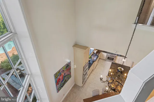a spacious bathroom with a granite countertop sink mirror and a bathtub