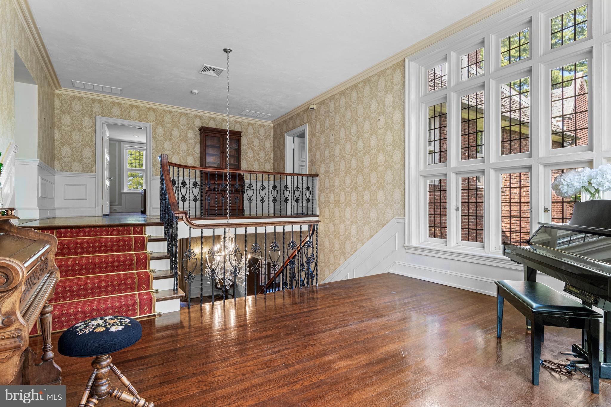 717 North Spring Mill Road Villanova, PA 19085 - Photo 34 of 62 a view of an empty room with wooden floor and furniture