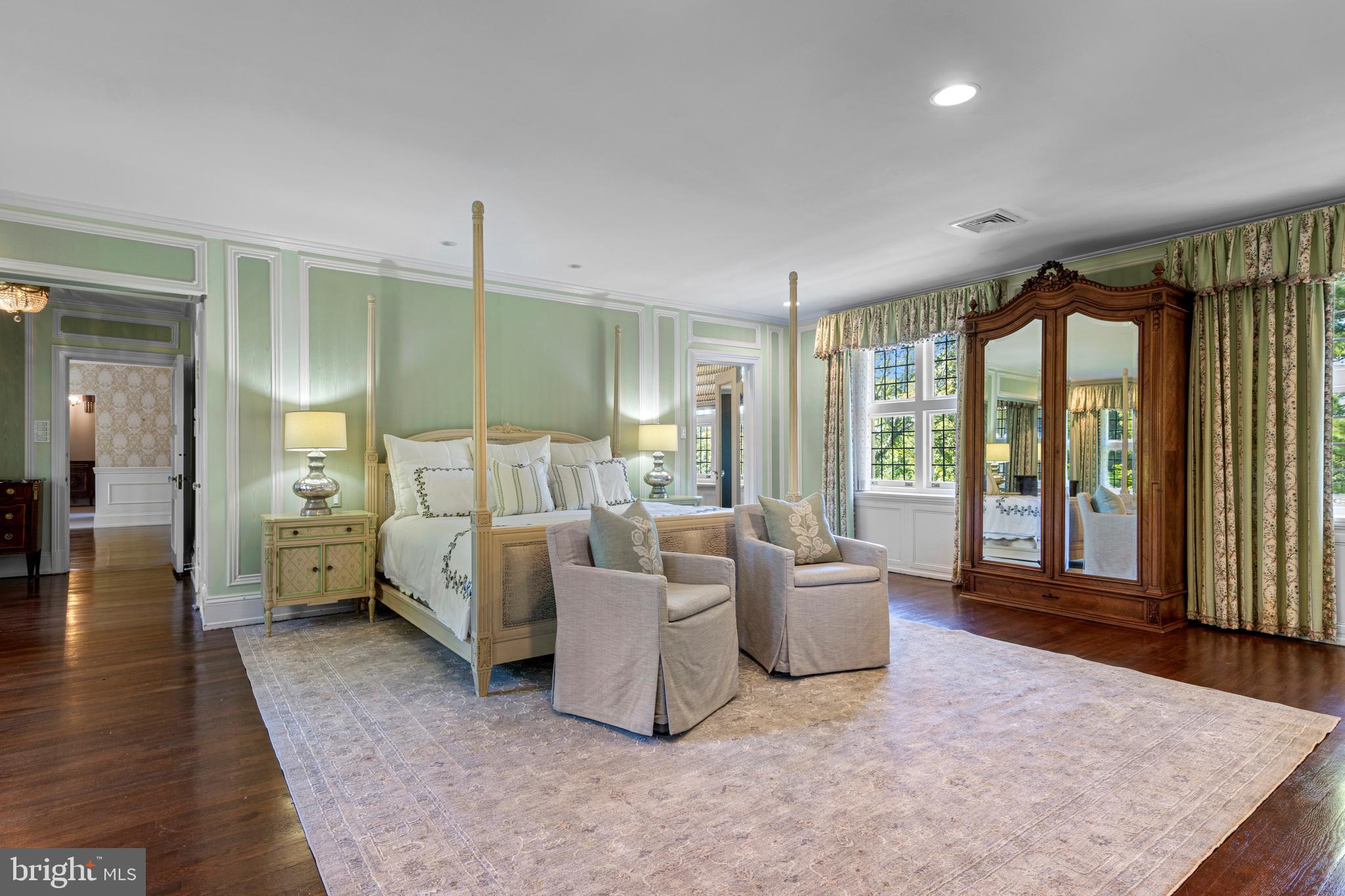 717 North Spring Mill Road Villanova, PA 19085 - Photo 36 of 62 a living room with furniture and large windows