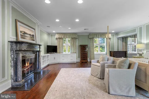 a spacious bedroom with a bed and a window