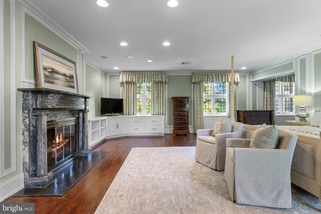 a spacious bedroom with a bed and a window