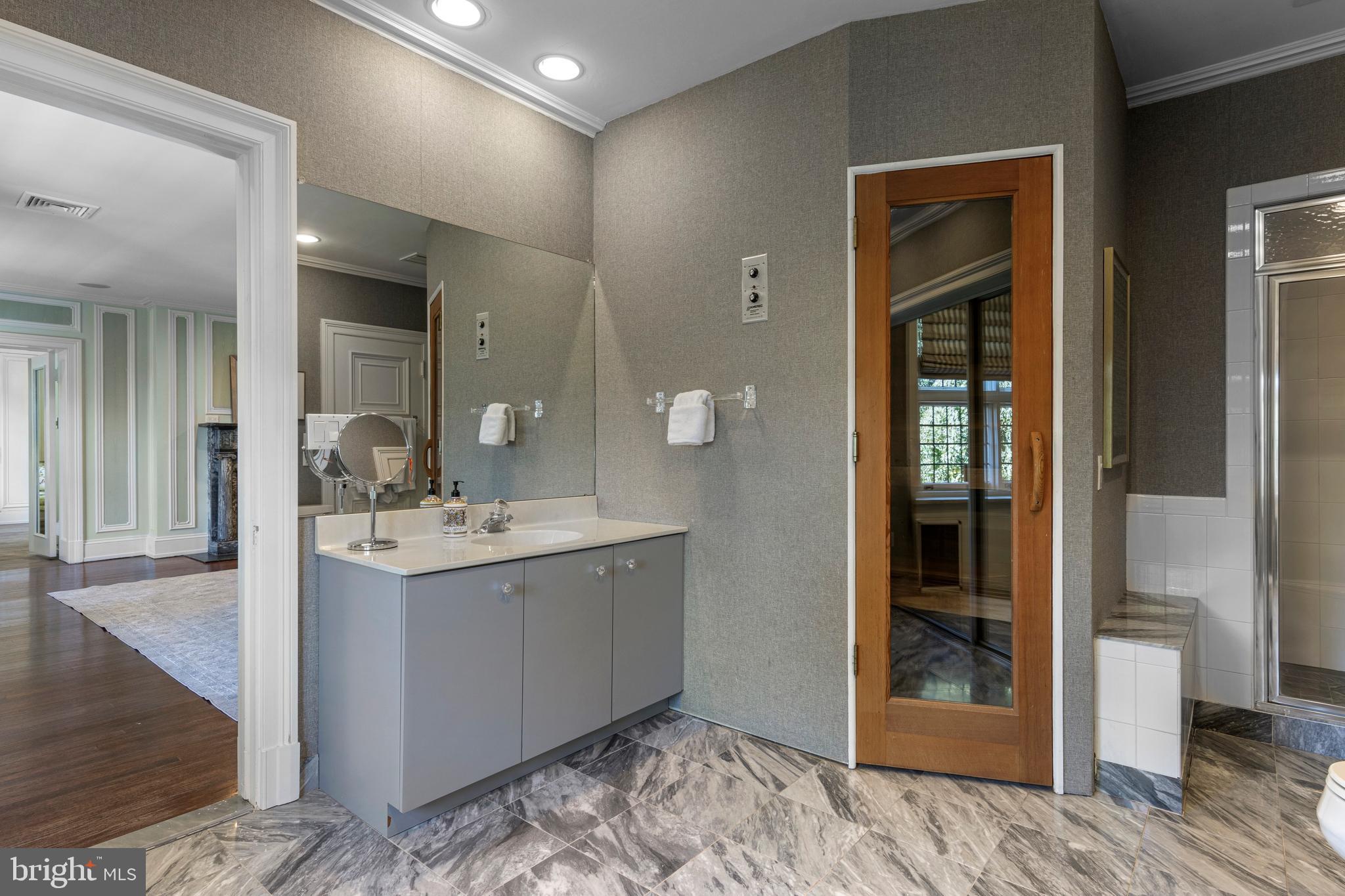 717 North Spring Mill Road Villanova, PA 19085 - Photo 42 of 62 a bathroom with a sink and a mirror