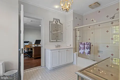 an aerial view of a house with a garden and trees
