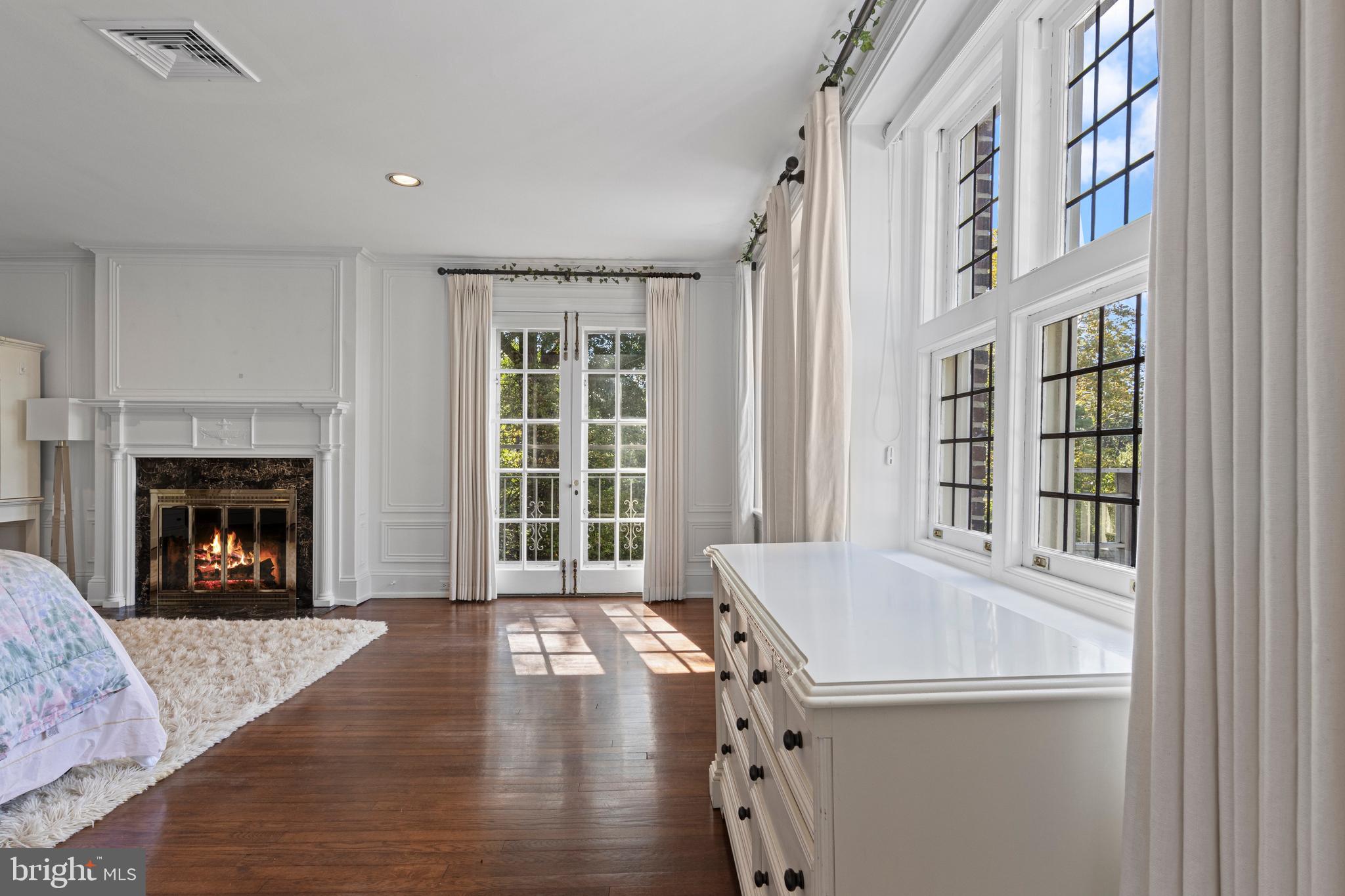 717 North Spring Mill Road Villanova, PA 19085 - Photo 46 of 62 a view of an empty room with window and fire place