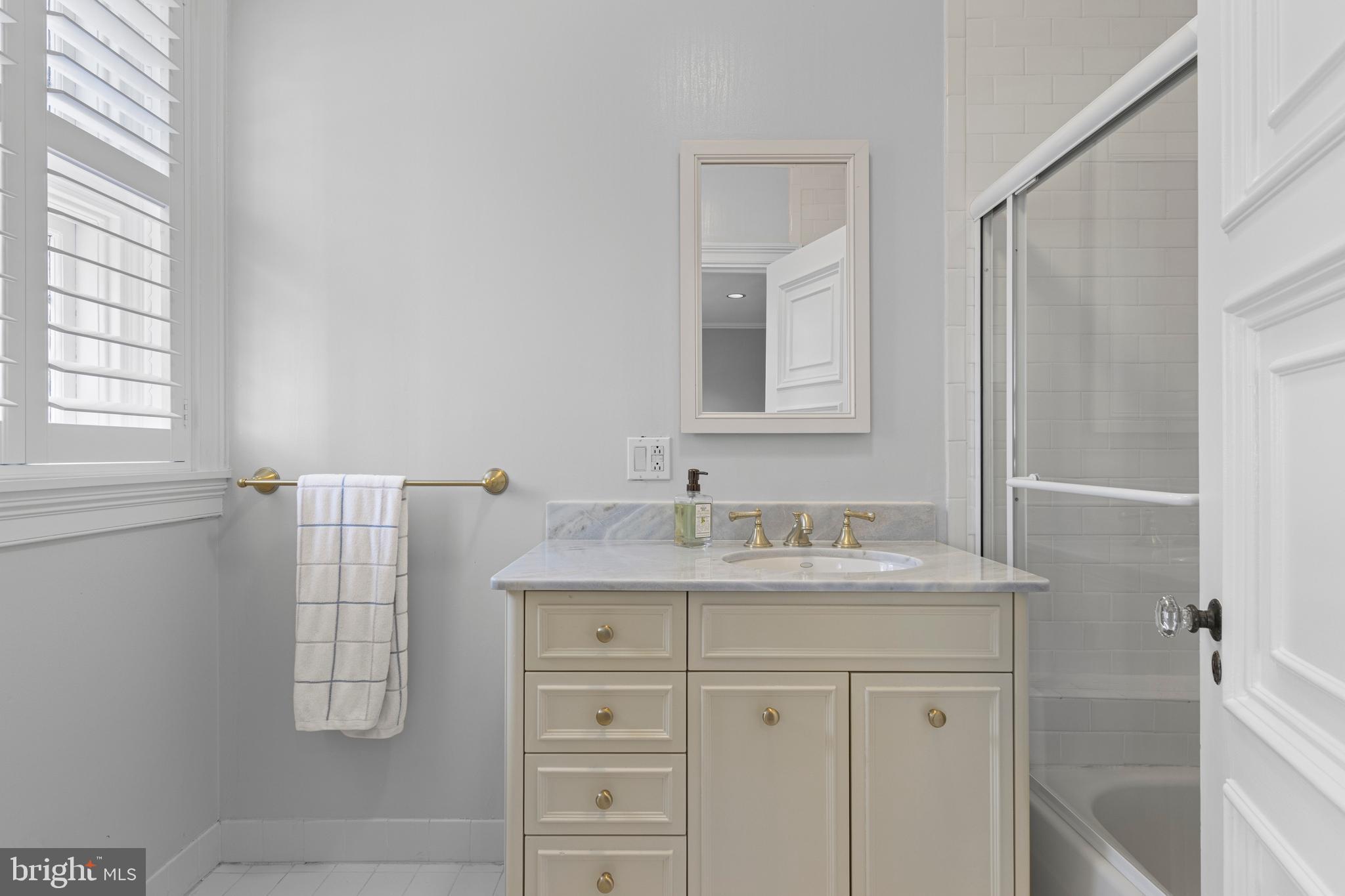 717 North Spring Mill Road Villanova, PA 19085 - Photo 48 of 62 a bathroom with a sink and a mirror