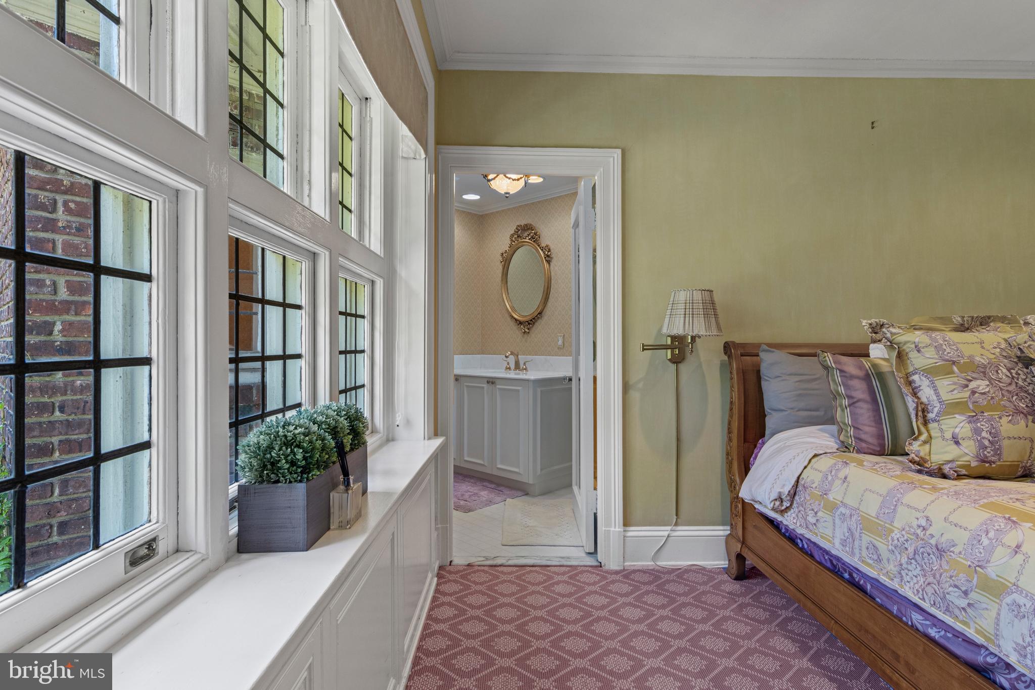 717 North Spring Mill Road Villanova, PA 19085 - Photo 50 of 62 a bedroom with a bed and a potted plant