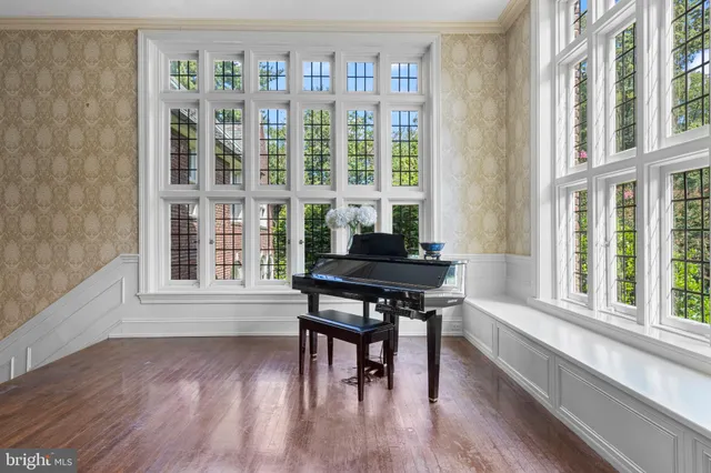 a view of an entryway with wooden floor and windows