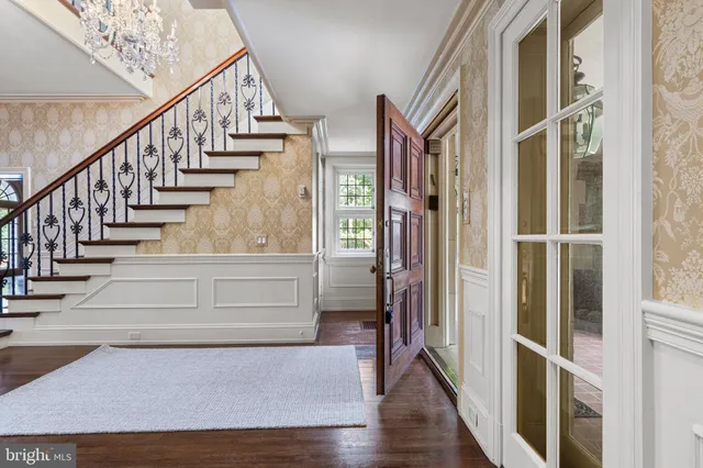 a living room with fireplace furniture and a wooden floor