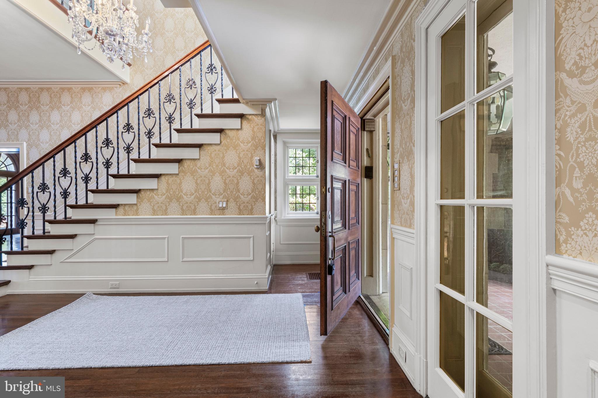 717 North Spring Mill Road Villanova, PA 19085 - Photo 9 of 62 a view of an entryway with wooden floor and windows