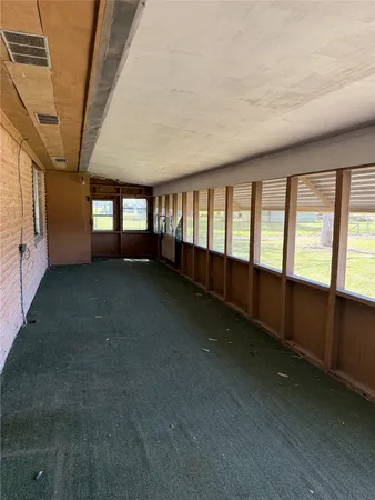 a view of kitchen with furniture and large window