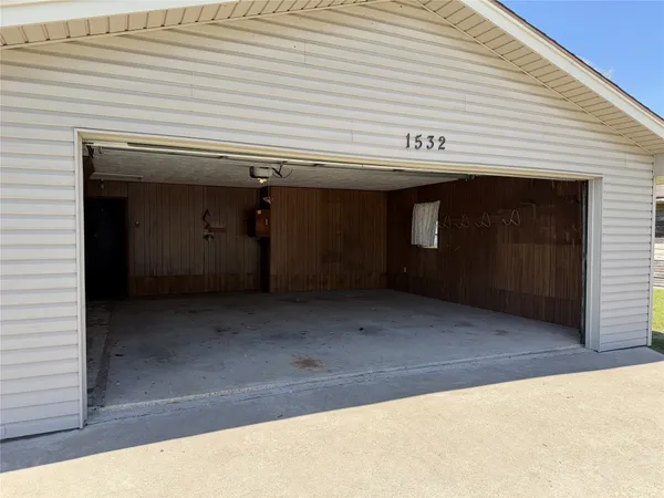 a view of a big yard with an outdoor space and seating area