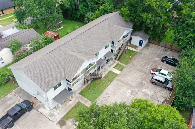 a aerial view of a house with a yard