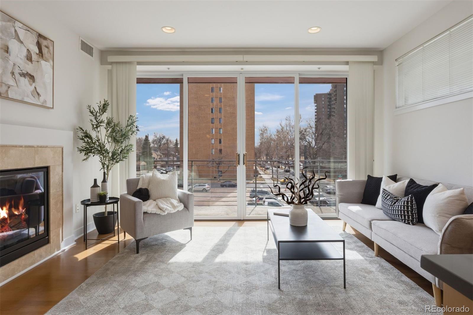 360 South Lafayette Street, Unit 301 Denver, CO 80209 - Photo 1 of 29 a living room with furniture and a large window