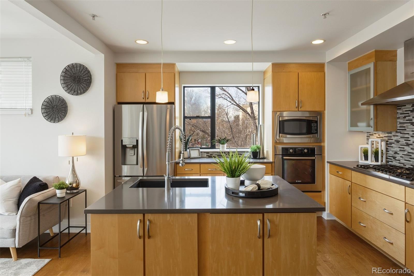 360 South Lafayette Street, Unit 301 Denver, CO 80209 - Photo 11 of 29 a kitchen with sink refrigerator and microwave