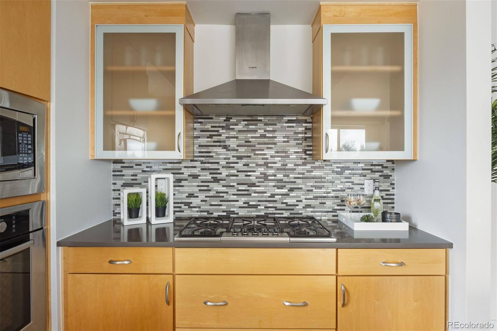 360 South Lafayette Street, Unit 301 Denver, CO 80209 - Photo 12 of 29 a kitchen with a sink and a potted plant on the counter