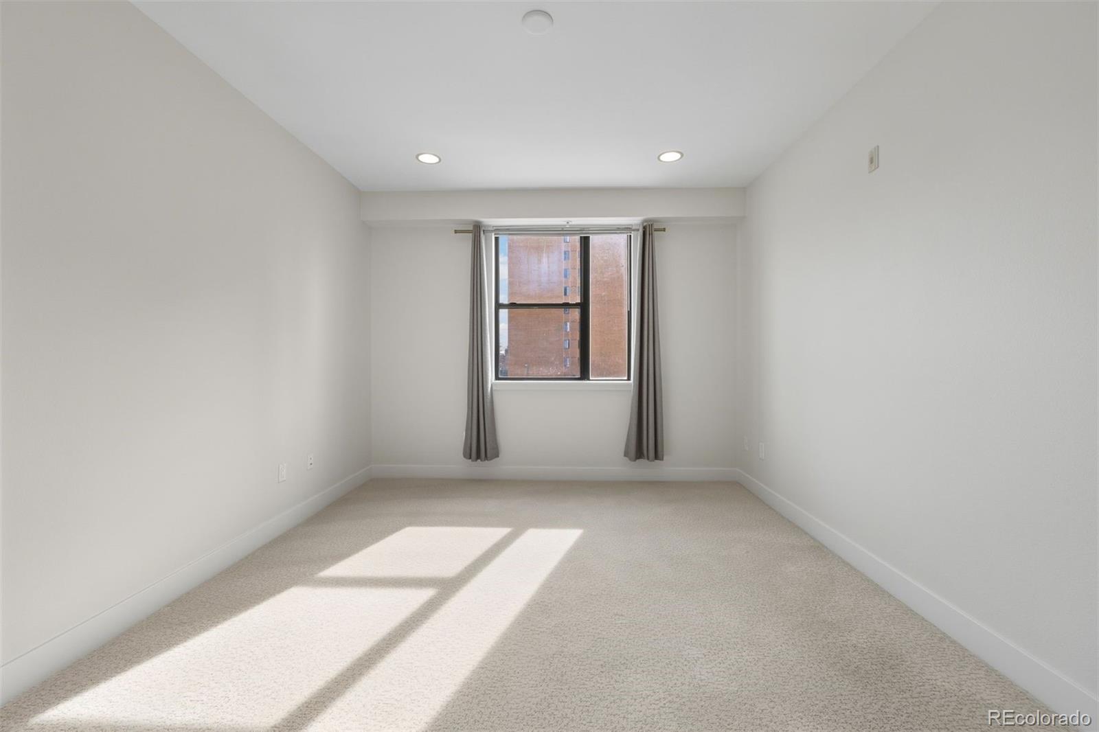 360 South Lafayette Street, Unit 301 Denver, CO 80209 - Photo 16 of 29 an empty room with windows