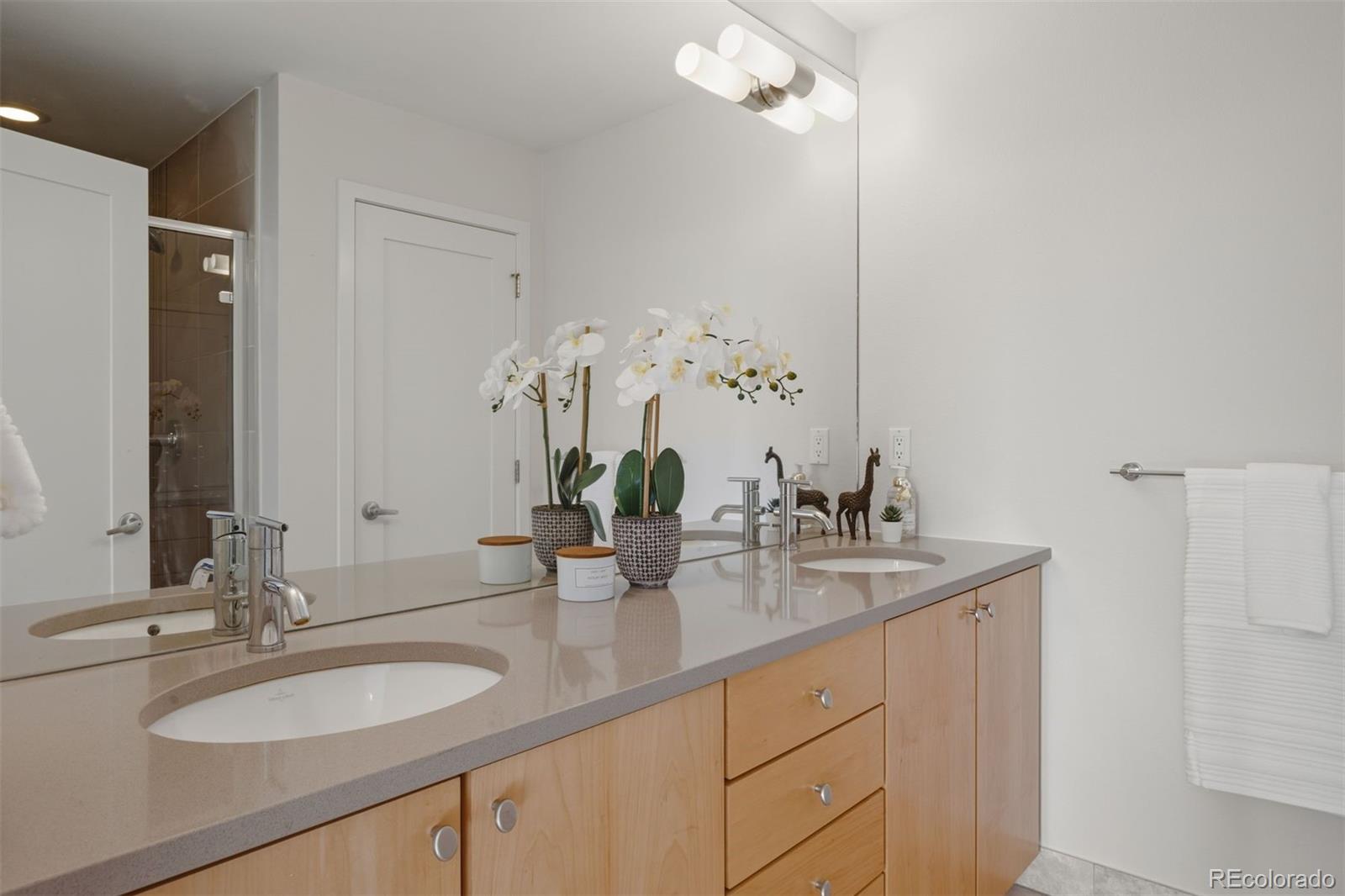360 South Lafayette Street, Unit 301 Denver, CO 80209 - Photo 17 of 29 a bathroom with a granite countertop sink and a mirror