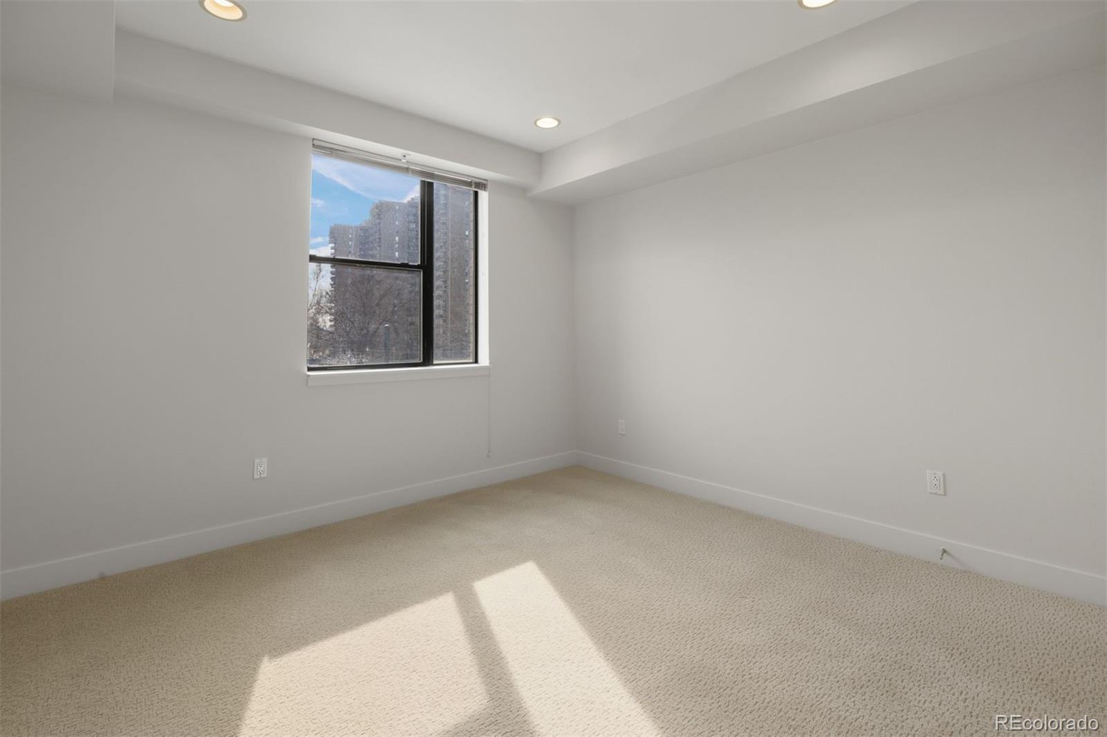 360 South Lafayette Street, Unit 301 Denver, CO 80209 - Photo 19 of 29 an empty room with windows