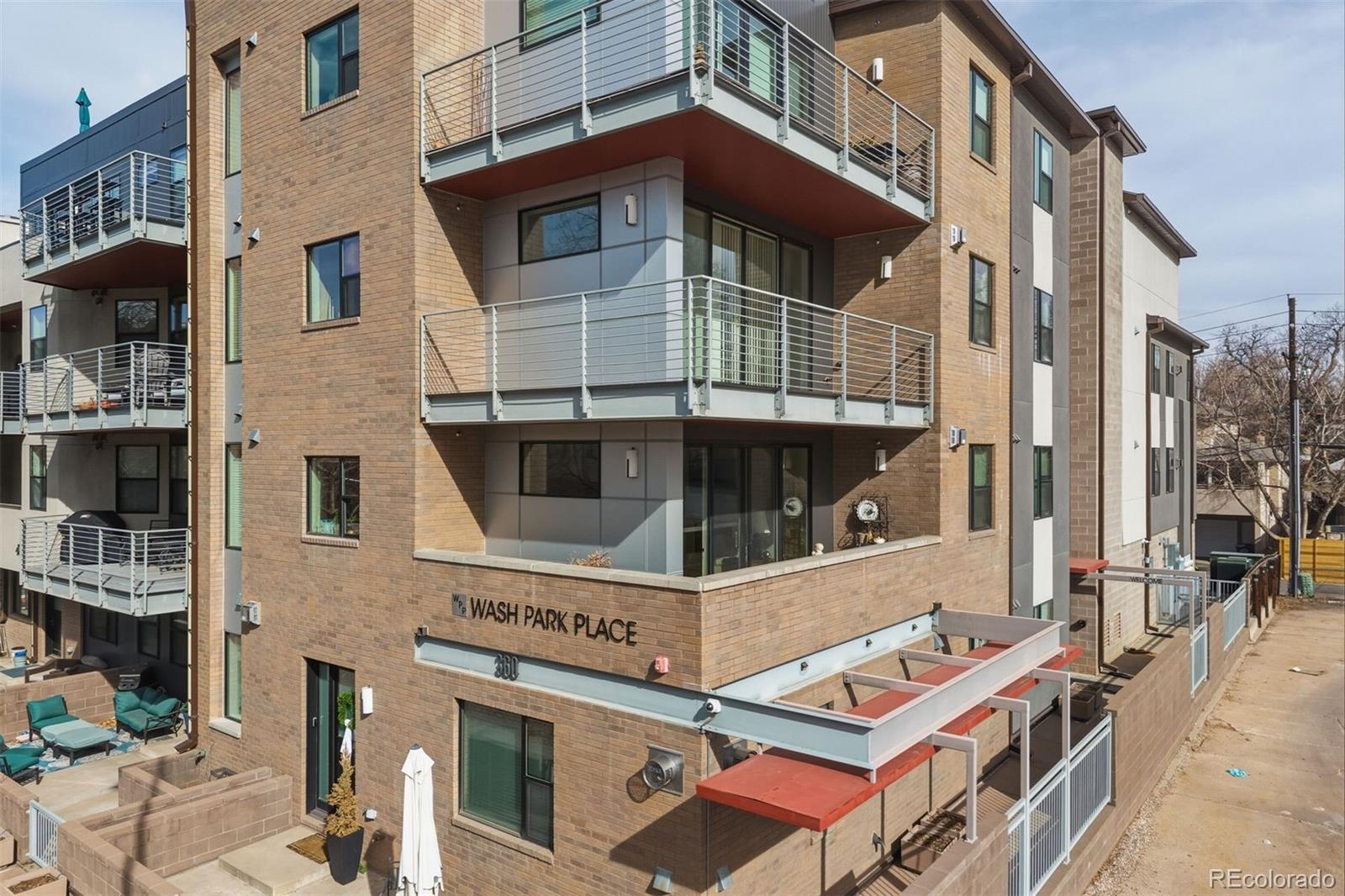 360 South Lafayette Street, Unit 301 Denver, CO 80209 - Photo 3 of 29 a front view of a building with a yard