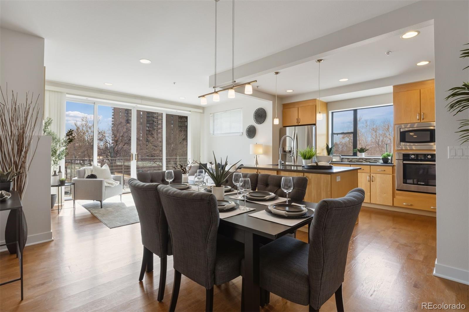 360 South Lafayette Street, Unit 301 Denver, CO 80209 - Photo 10 of 29 a view of a dining room with furniture window and wooden floor