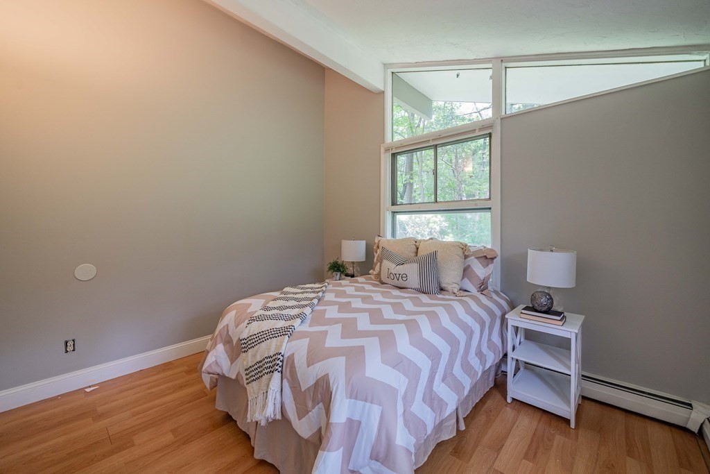7 Turning Mill Road Lexington, MA 02420 - Photo 5 of 18 a bedroom with a bed and a window