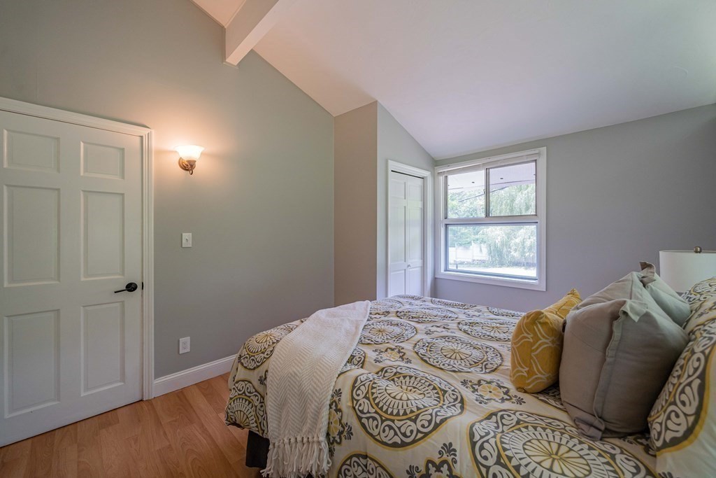 7 Turning Mill Road Lexington, MA 02420 - Photo 8 of 18 a bedroom with a bed and a window