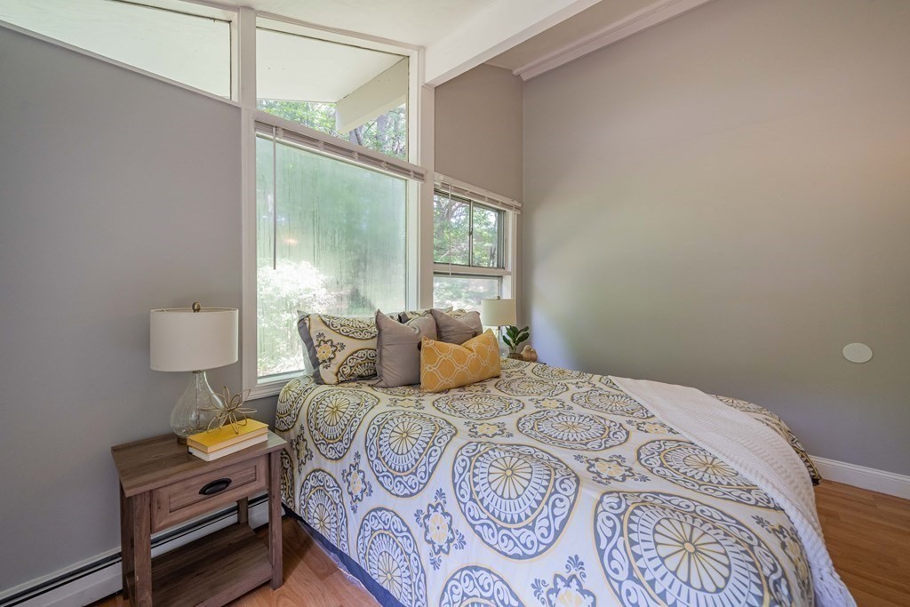7 Turning Mill Road Lexington, MA 02420 - Photo 10 of 18 a bedroom with a bed and a window