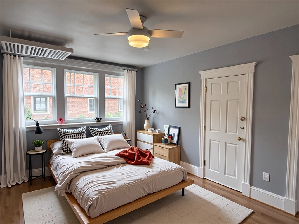 36 St Paul Street, Unit B Brookline, MA 02446 - Photo 3 of 6 a bedroom with a bed and a chandelier