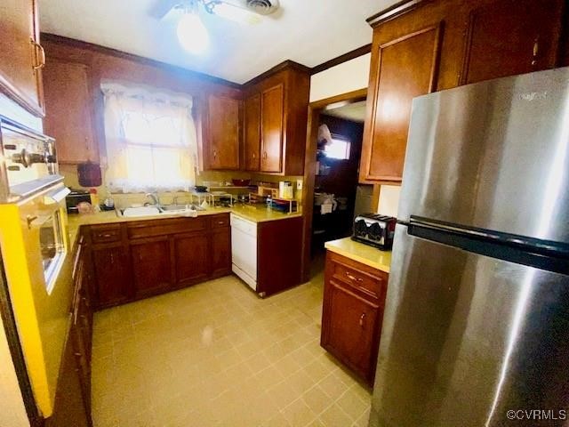 5939 Dry Bread Road Emporia, VA 23847 - Photo 3 of 22 a kitchen with stainless steel appliances granite countertop a refrigerator a stove and a sink