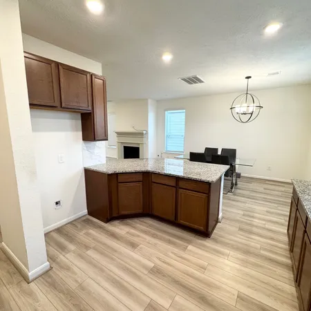 a kitchen with stainless steel appliances granite countertop a sink and cabinets