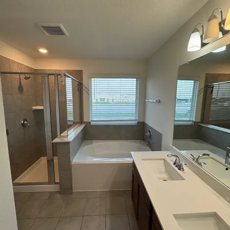 a bathroom with a bathtub and a sink