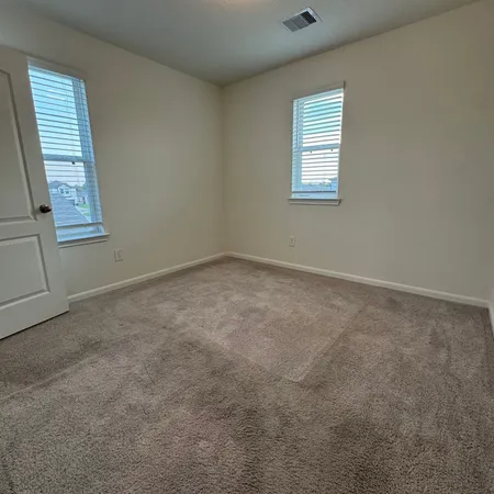 an empty room with windows